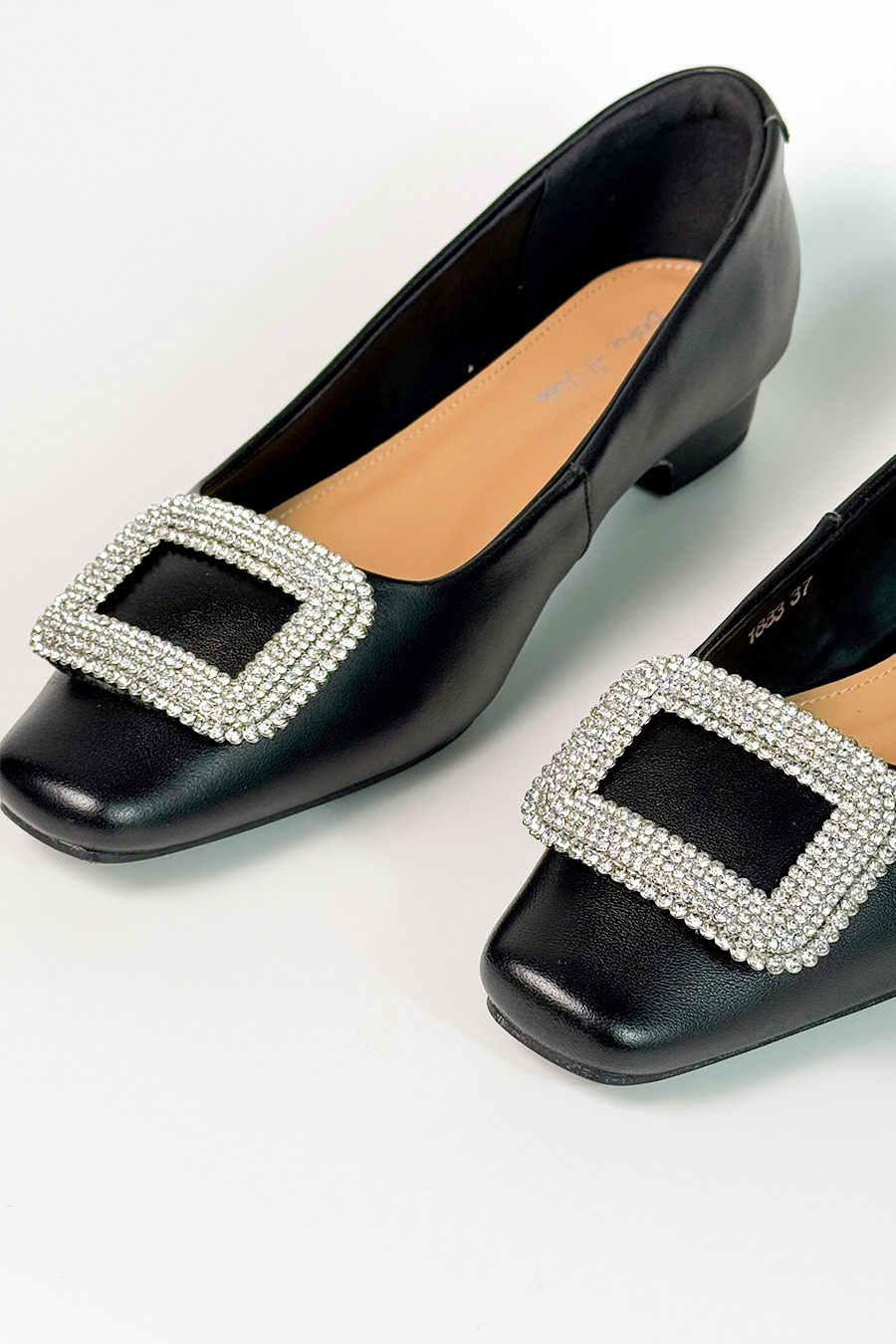 Glossy black leather flat