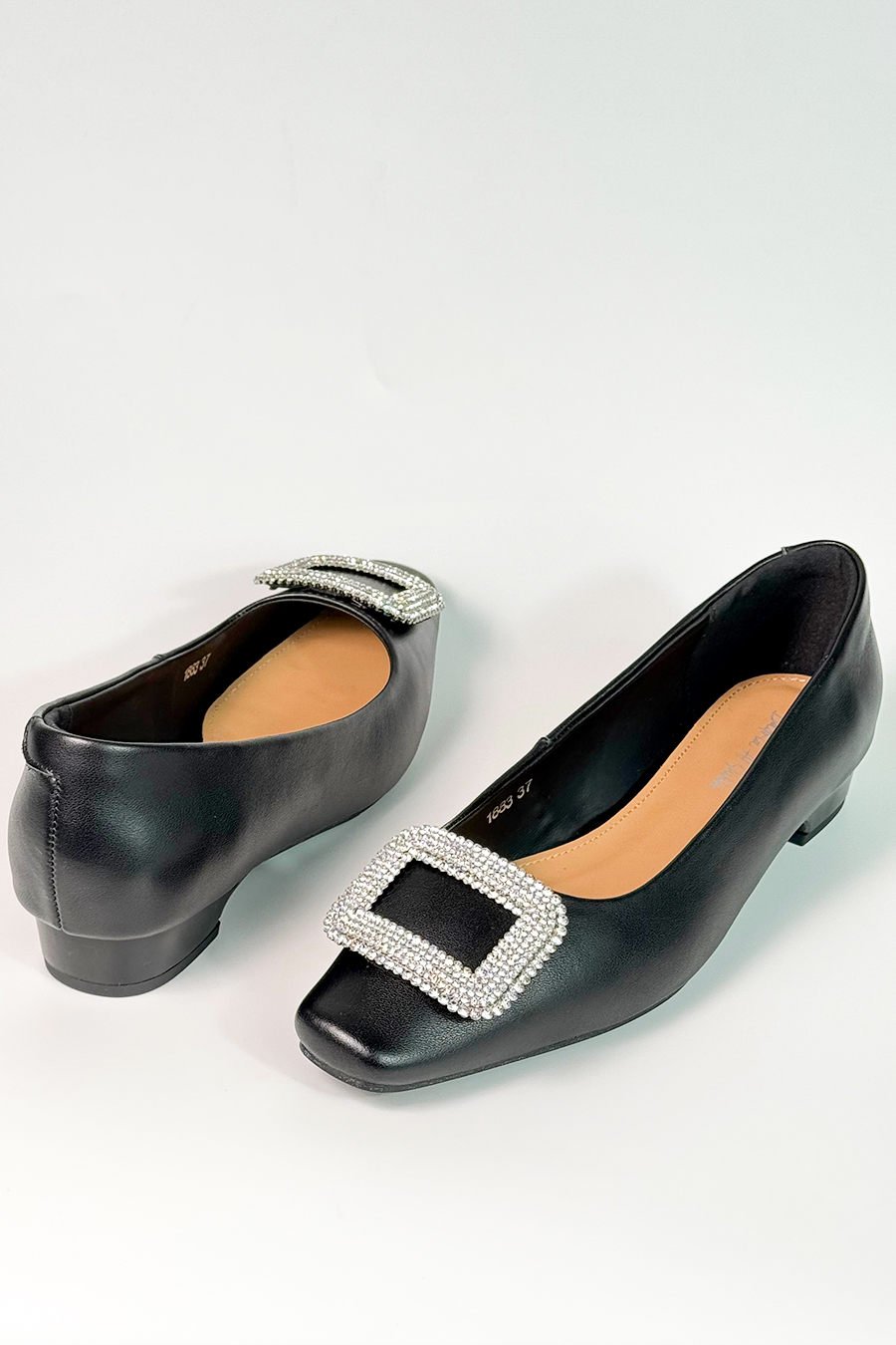 Glossy black leather flat
